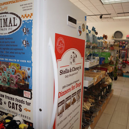 A pet store interior showing a freezer with 